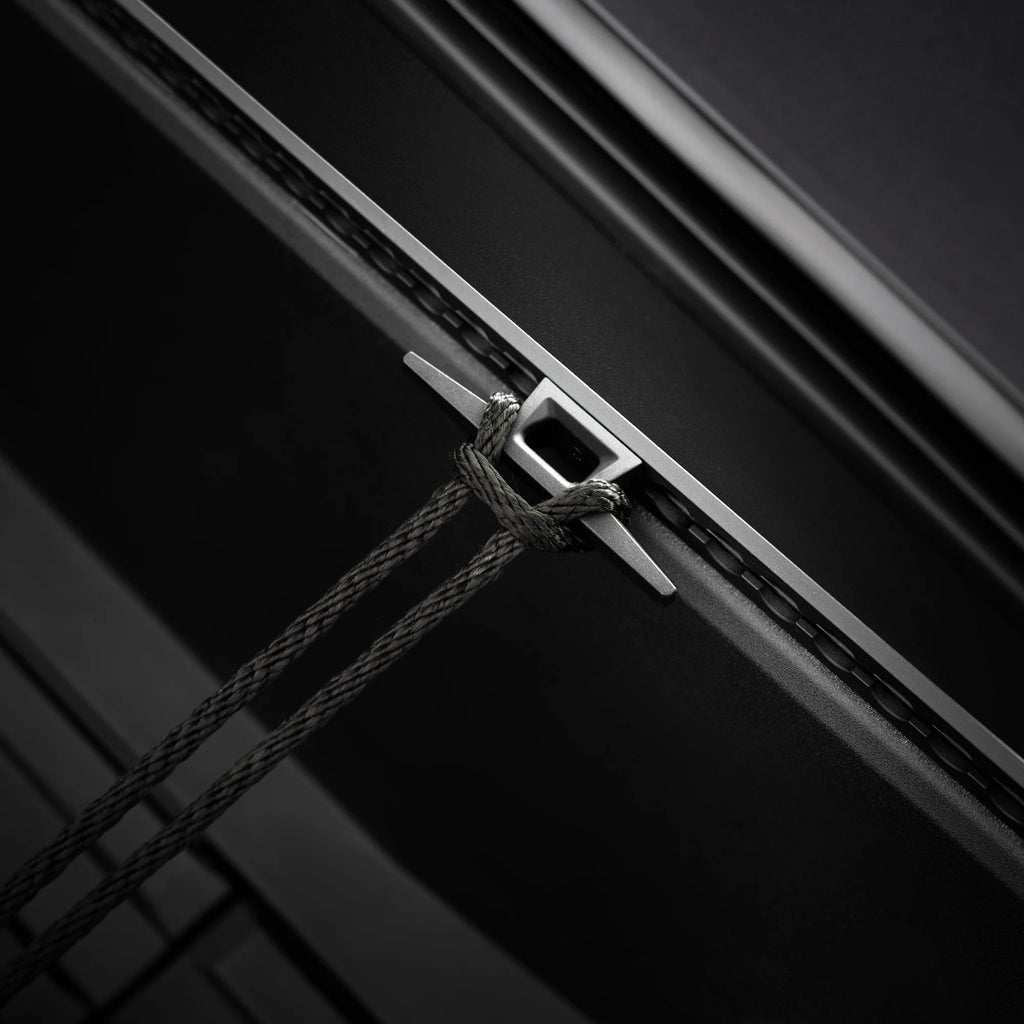 The rope is tied to Tesla  Cybertruck L-Track Cleat